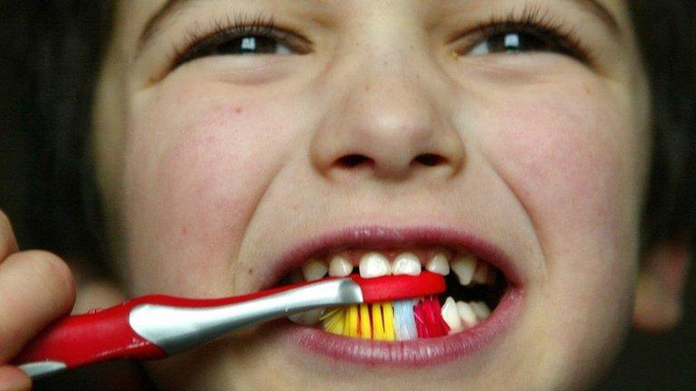 Child brushing teeth