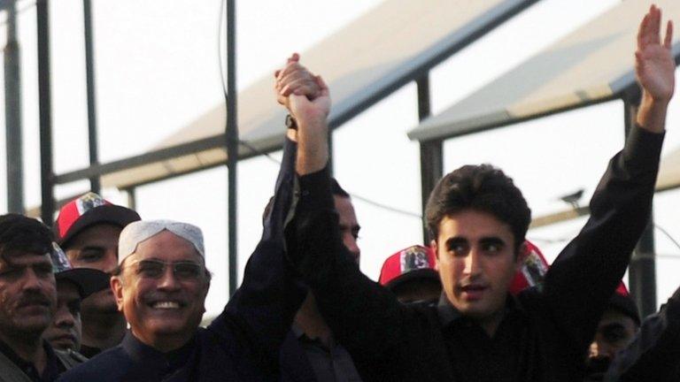 Bilawal Bhutto-Zardari (R) with his father, President Asif Ali Zardari, waving to supporters (27 Dec 2012)