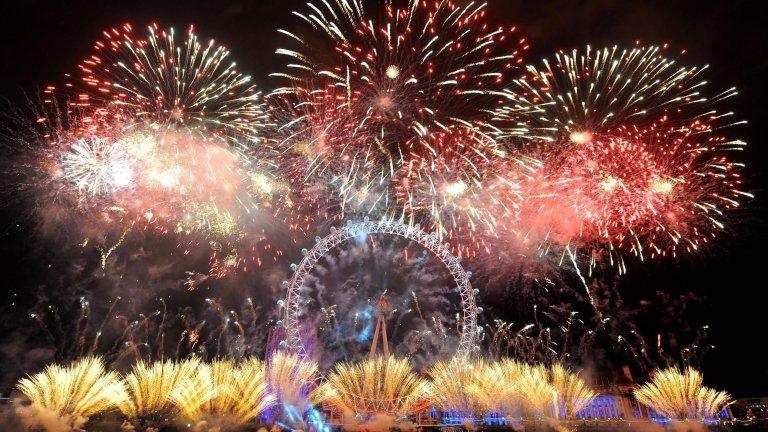 Fireworks explode over the London Eye in central London as part of new year celebrations