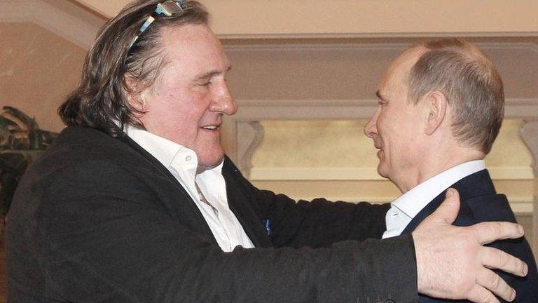 Russian President Vladimir Putin (R) greets French actor Gerard Depardieu in Sochi, 5 January