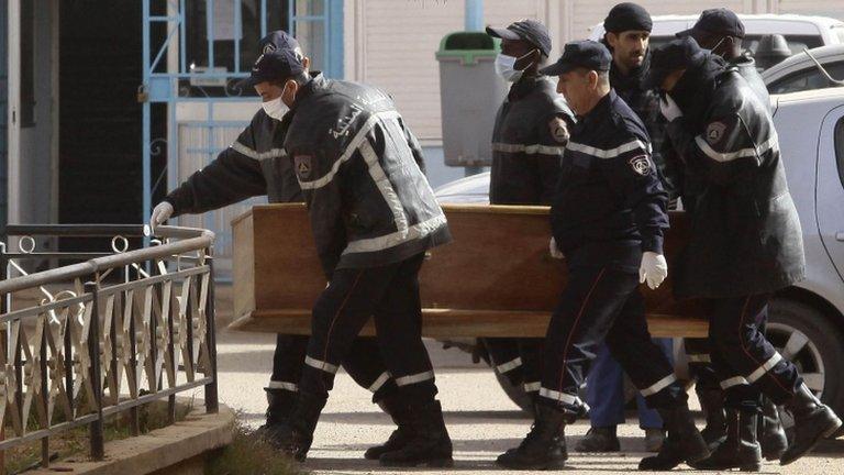 Rescue workers carry the coffin of one of the hostages killed during a hostage crisis in a gas plant at the hospital in In Amenas, 21 January 2013.