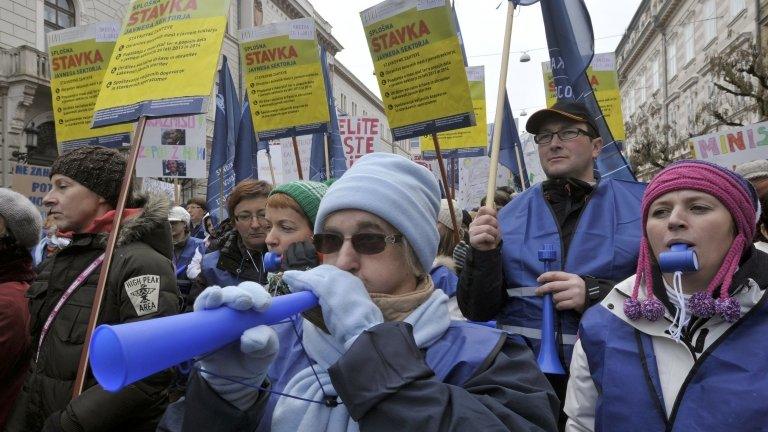 Protesters march during public sector workers' strike in Ljubljana - 23 January