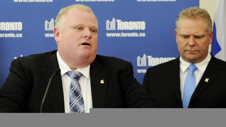 Toronto Mayor Rob Ford speaks to the media at City Hall supported by his brother, Councillor Doug Ford after winning his conflict of interest appeal in Toronto, Ontario, 25 January 2013