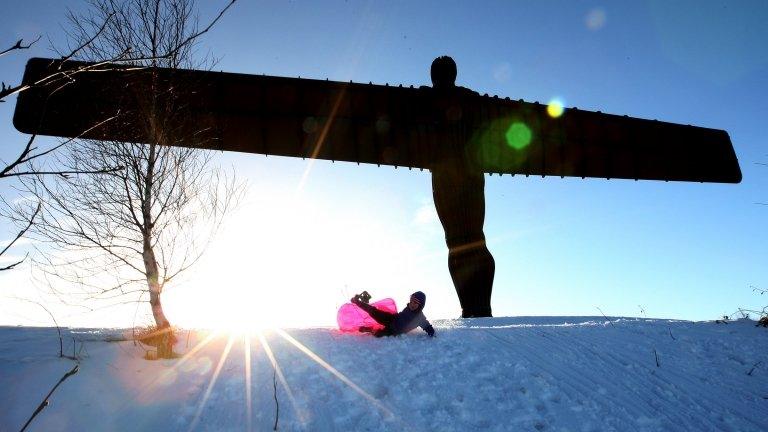 Child sledging by Angel of the North, Gateshead