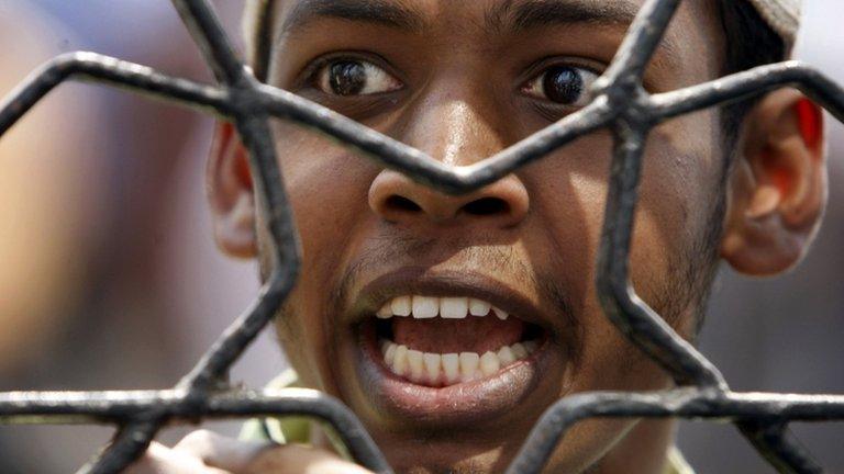 An Islamist activist shouts during a protest in Dhaka