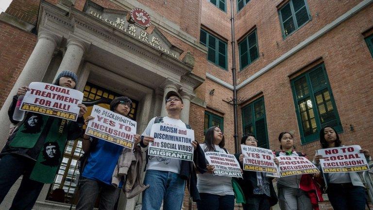 Demonstrators display placards asking for equal rights outside the Court of Final Appeal in Hong Kong, 26 February 2013