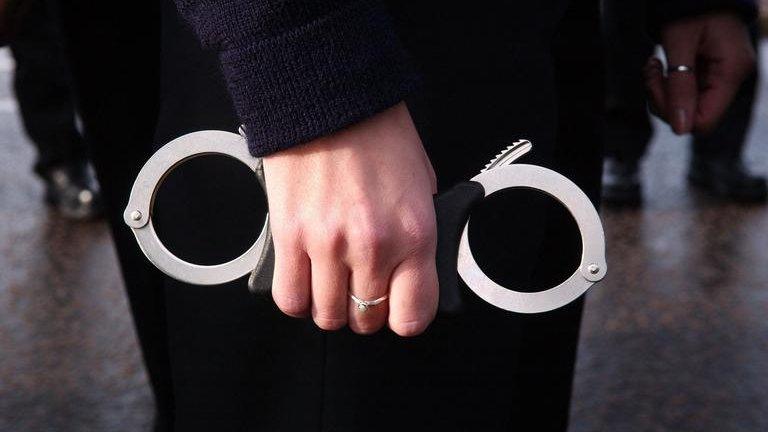 Police officer with handcuffs