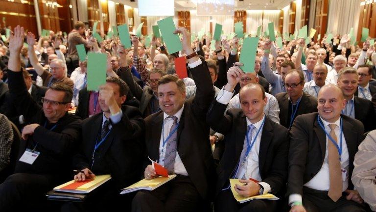 Delegates vote during the first party congress in Berlin on 14 April.