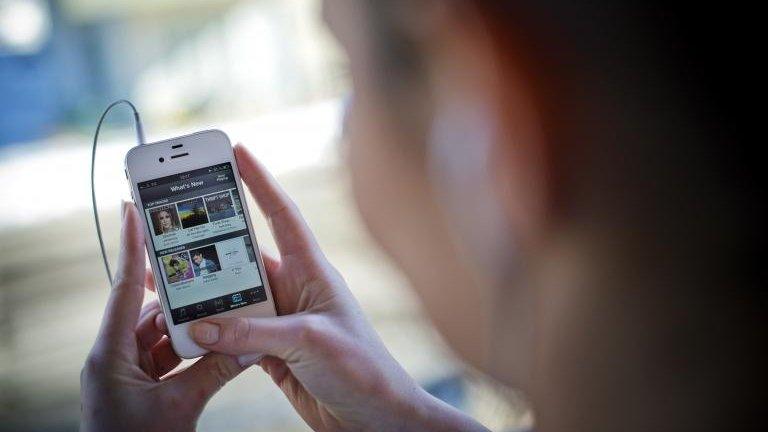 A woman listens to Spotify in Sweden