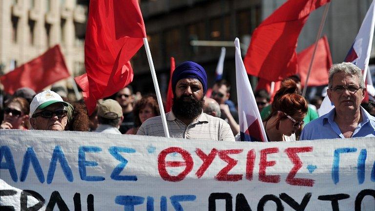 Protesters and strikers outside the Greek parliament. 1 May 2013