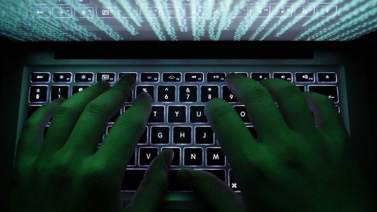 File photo: person typing at computer keyboard