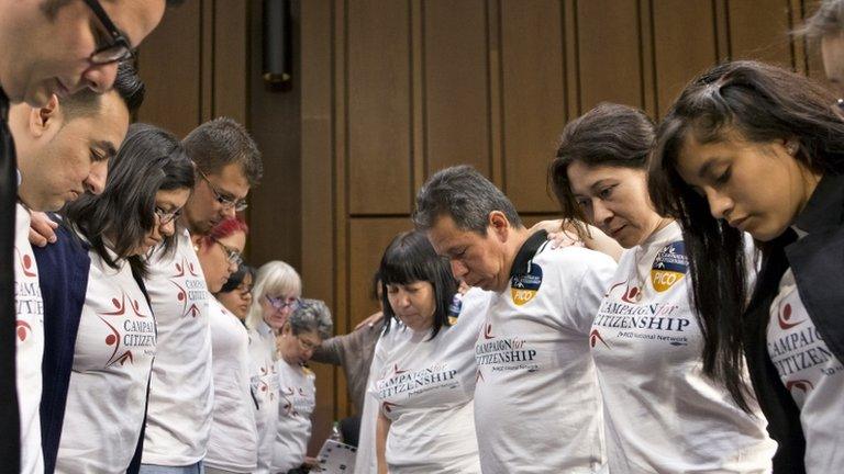 Immigration activists gather for prayer before the Senate Judiciary Committee began working on a landmark immigration bill to secure the border and offer citizenship to millions 20 May 2013