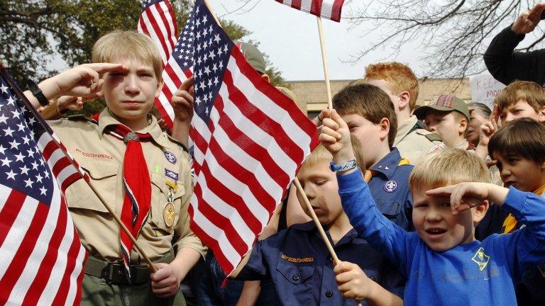 Boy scouts recite the US pledge of allegiance in front of the group's headquarters in Dallas, Texas February 2013