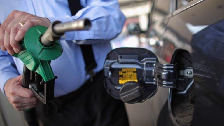 A man filling up his car with petrol