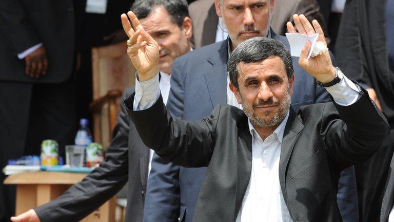 Mahmoud Ahmadinejad waves as he arrives in Accra, Ghana