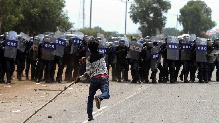 Protester throws stones at police in Kompong Speu. 3 June 2013