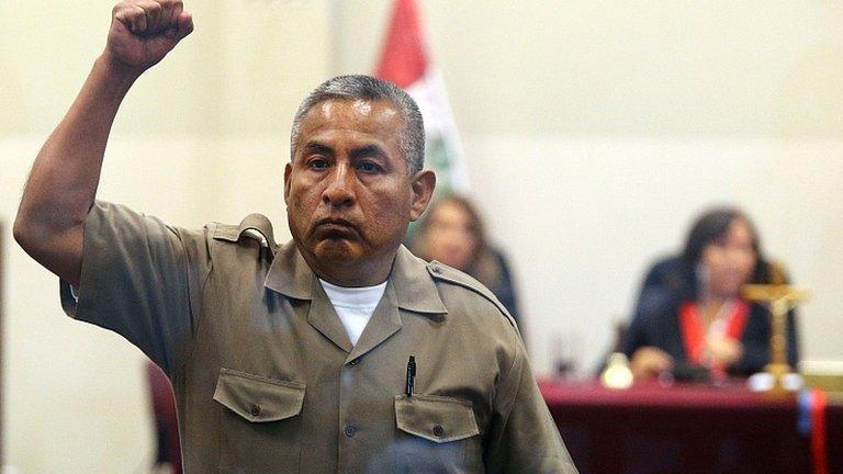 Florindo Flores raises a fist as he is sentenced. 7 June 2013