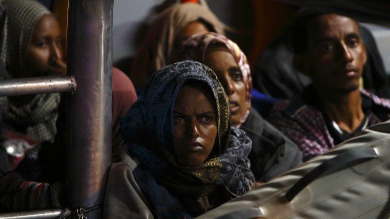 Migrants arrive in port in Malta after being rescued from a drifting boat, 4/7/2013