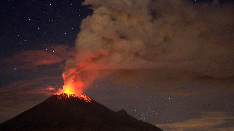 Ash spew from Mexico's Popocatepetl volcano, seen from San Mateo Ozolco, in the Mexican central state of Puebla, on 4 July