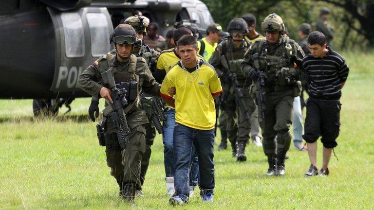 Alleged Farc members escorted by Colombian police, 26 April 13