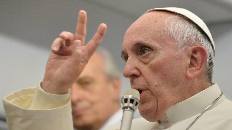 Pope Francis speaks to reporters during flight from Brazil