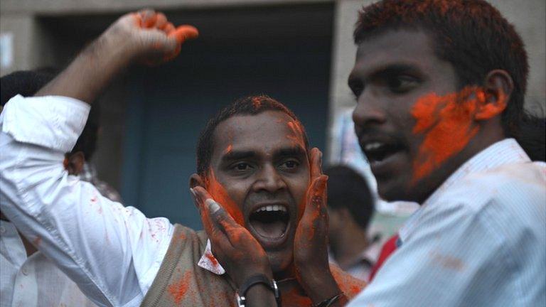 Osmania University students celebrate after the announcement of the separate Indian state of Telangana in Hyderabad on July 30, 2013.