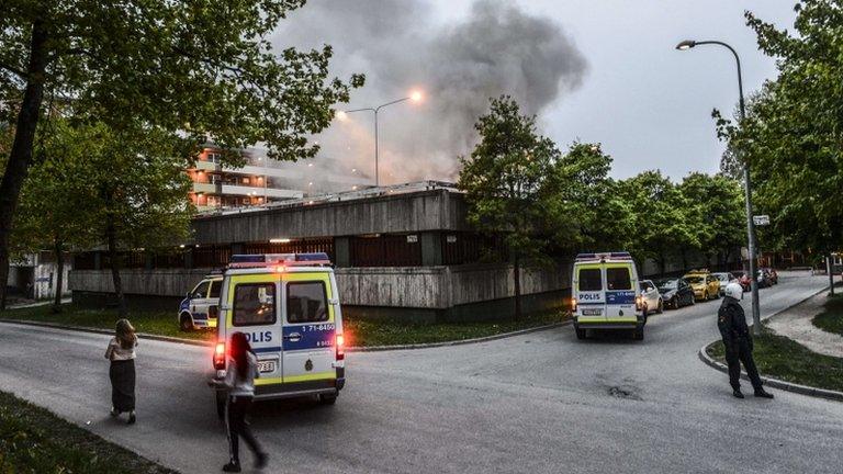 Police secure an area of Husby, Stockholm, during rioting, 20 May