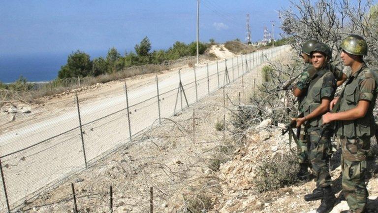 File photo - Lebanese soldiers guard border fence