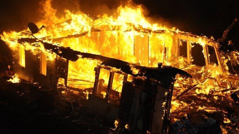 A home burns near Banning, California on 7 August 2013