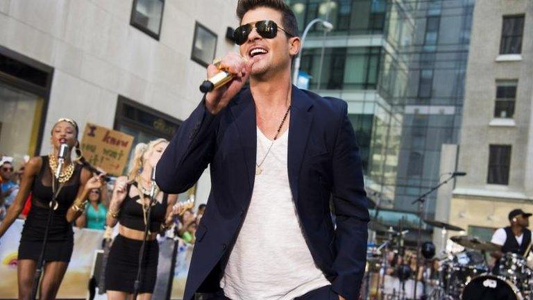 Robin Thicke, performing Blurred Lines in New York