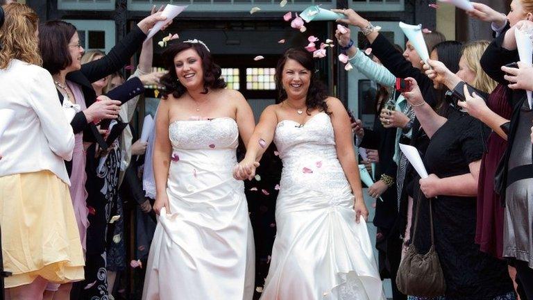 Jess Ives (R) and Rachel Briscoe (L) from the Bay of Islands celebrate their marriage at the Rotorua Museum in Rotorua on Monday - one of the New Zealand's first same-sex couples to wed