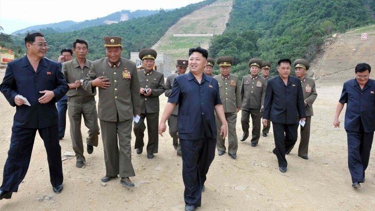 North Korean leader Kim Jong-un tours the construction site of the planned Masik ski resort with an entourage of military leaders