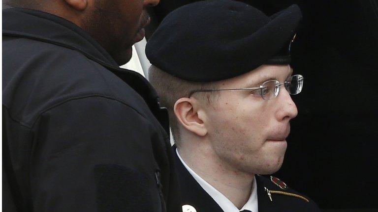 US soldier Bradley Manning is escorted into court to receive his sentence at Fort Meade in Maryland 21 August 2013