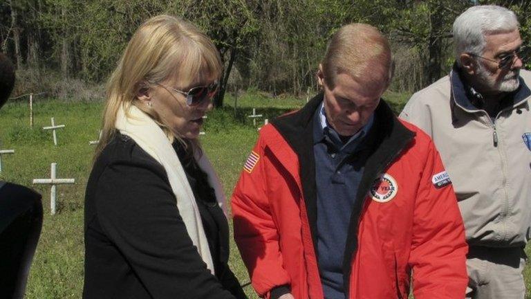 Forensic anthropologist shows a map of the graveyard to Senator Bill Nelson, during a tour of the closed Dozier School for Boys in Marianna, Florida.