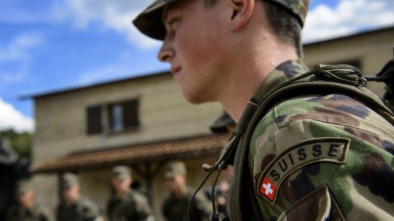 An aspirant-officer of the Swiss Army rescue troops takes part in a training session on 19 September, 2013, in Epeisse near Geneva.