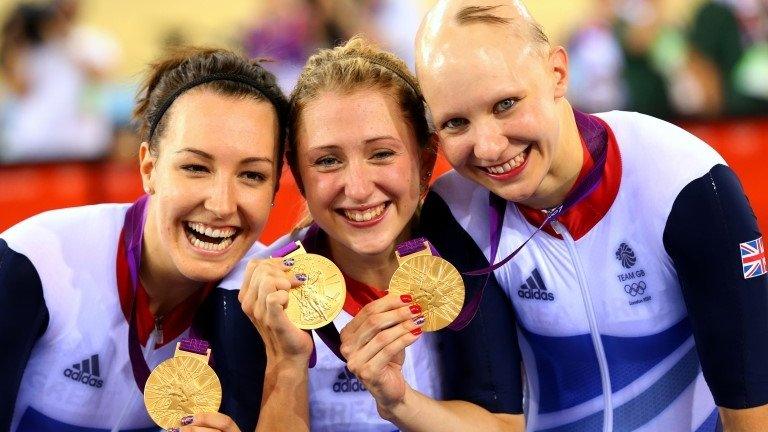 (l-r) Dani King, Laura Trott and Jo Rowsell celebrate winning Olympic gold at London 2012