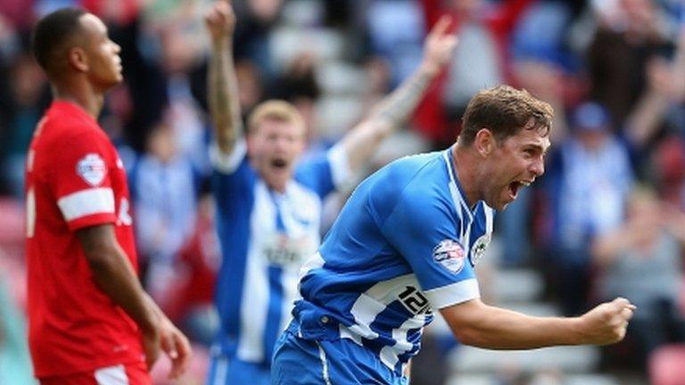 Grant Holt celebrates