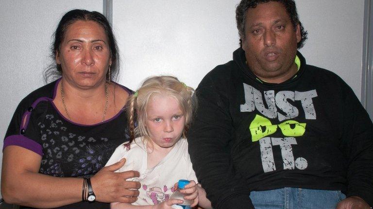 A undated handout photo released by the Greek Police on 21 October 2013 shows Maria (C) together with the couple posing as her parents at an undisclosed location