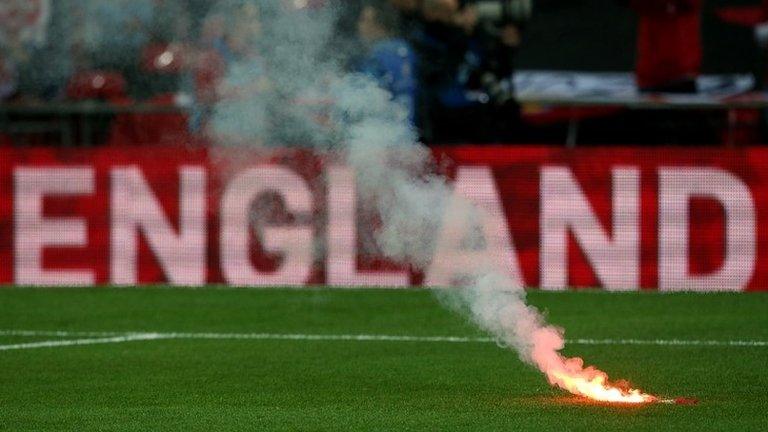 Flare on pitch during England v Poland