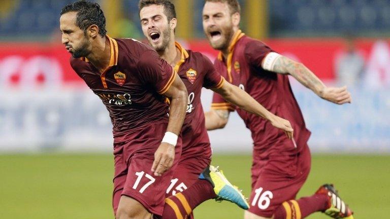 Roma players celebrate