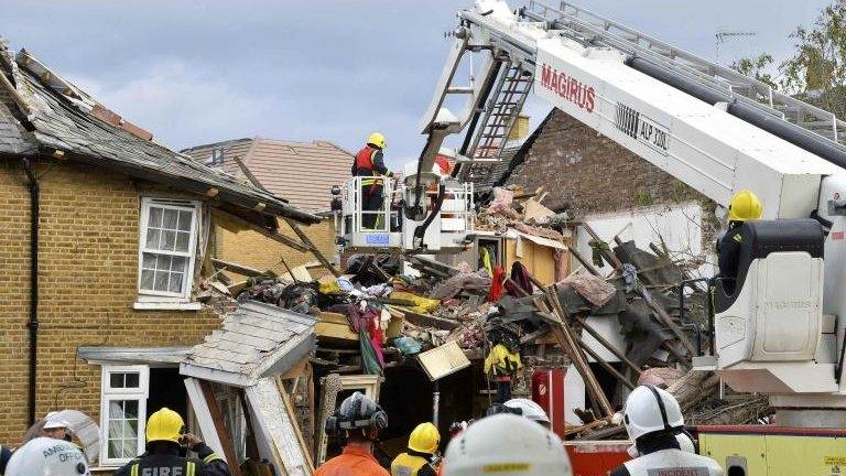 Emergency services work at scene of suspected gas explosion in Hounslow, west London