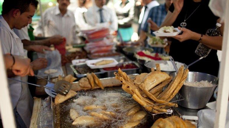 Mexican street vendors sell fried food