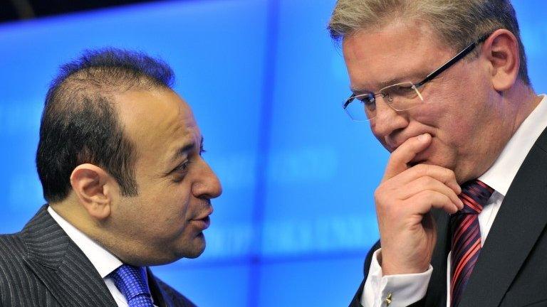 Turkish Minister for EU Affairs Egemen Bagis (L) talks to EU Commissioner for Enlargement Stefan Fuele in Brussels, 5 November