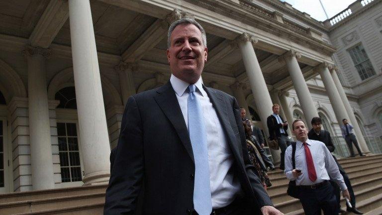 New York City Mayor-elect Bill de Blasio leaves City Hall after meeting with outgoing Mayor Michael Bloomberg on 6 November 2013