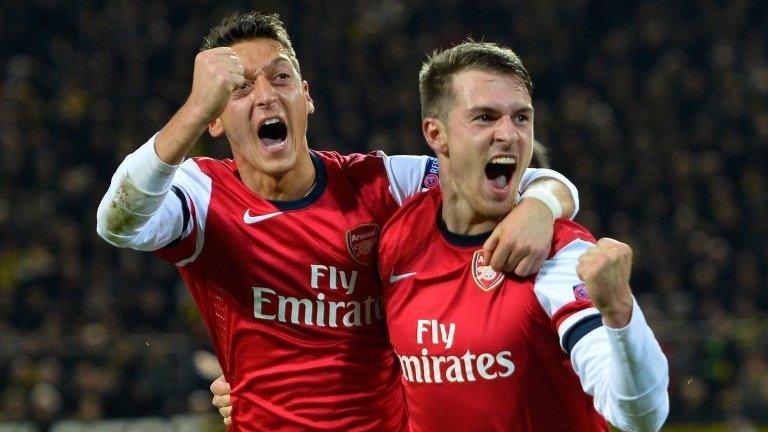 Aaron Ramsey celebrates with Mesut Ozil after putting Arsenal in front