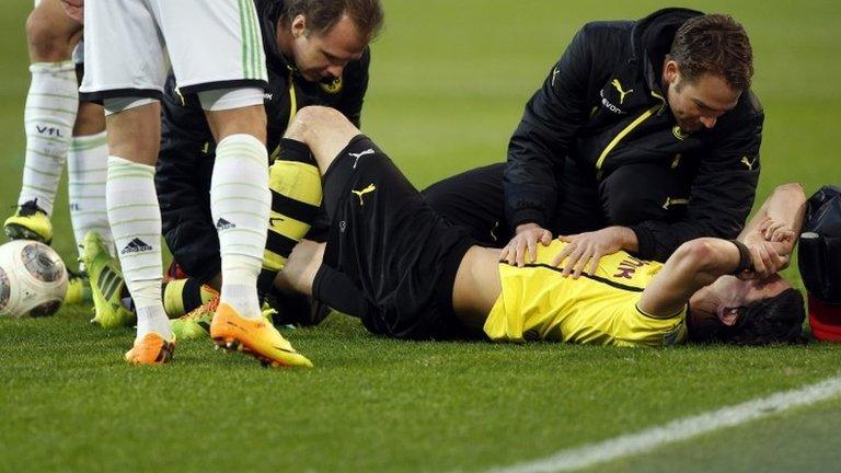 Borussia Dortmund defender Neven Subotic is carried off on a stretcher against Wolfsburg