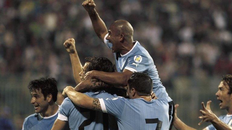 Uruguay celebrate Maxi Pereira's opener