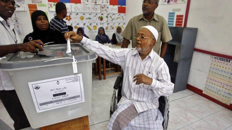 A man casts his vote in Male, Maldives