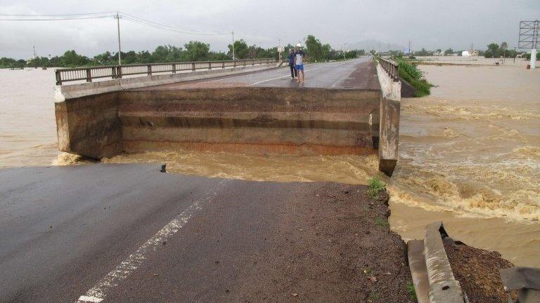 A bridge shattered by flooding in Binh Dinh province, Vietnam, 16 November