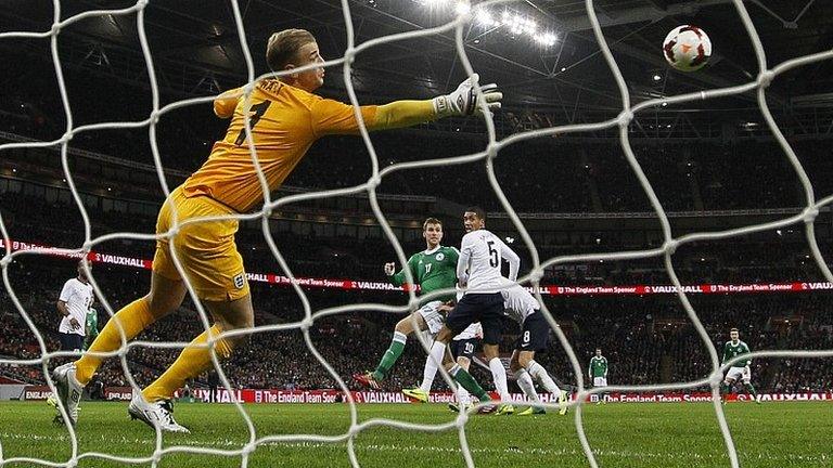 Germany's Per Mertesacker scores against England